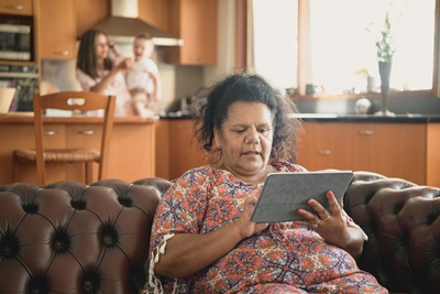 Woman on iPad making an appointment