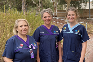 Photograph of three nurses and midwives outside AHS